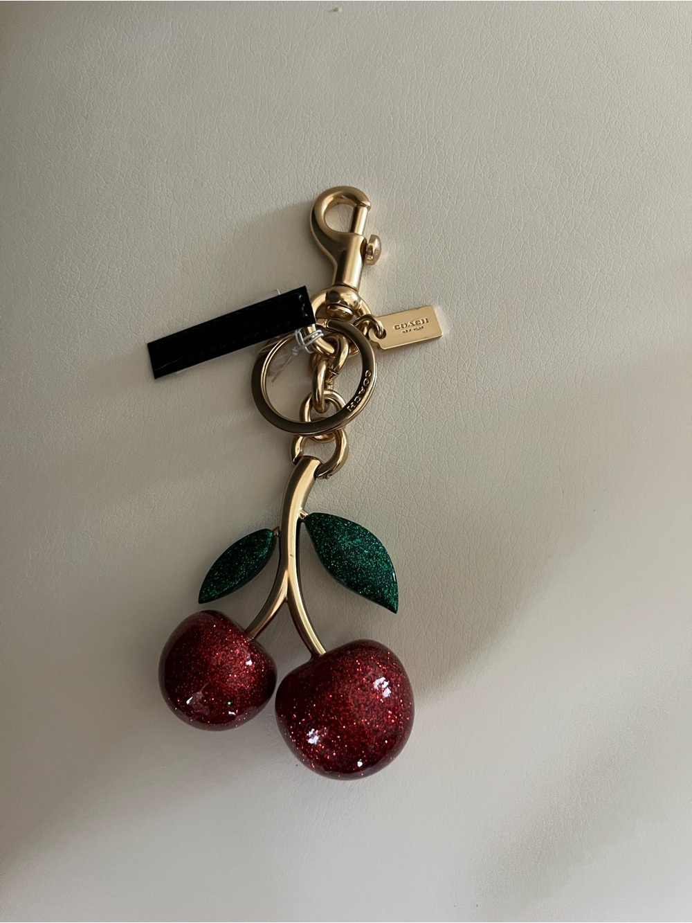Coach Gold-Tone Glitter Cherry Keychain with Red Cherries & Green Leaves
